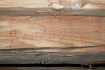 Inscription "Grand Orgue" on a roof beam above the Trinity Organ, condition 2007; specific meaning unclear.